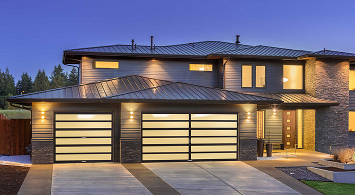 3 car sized garage with a single garage door and a double garage door, glasses and partly see through.