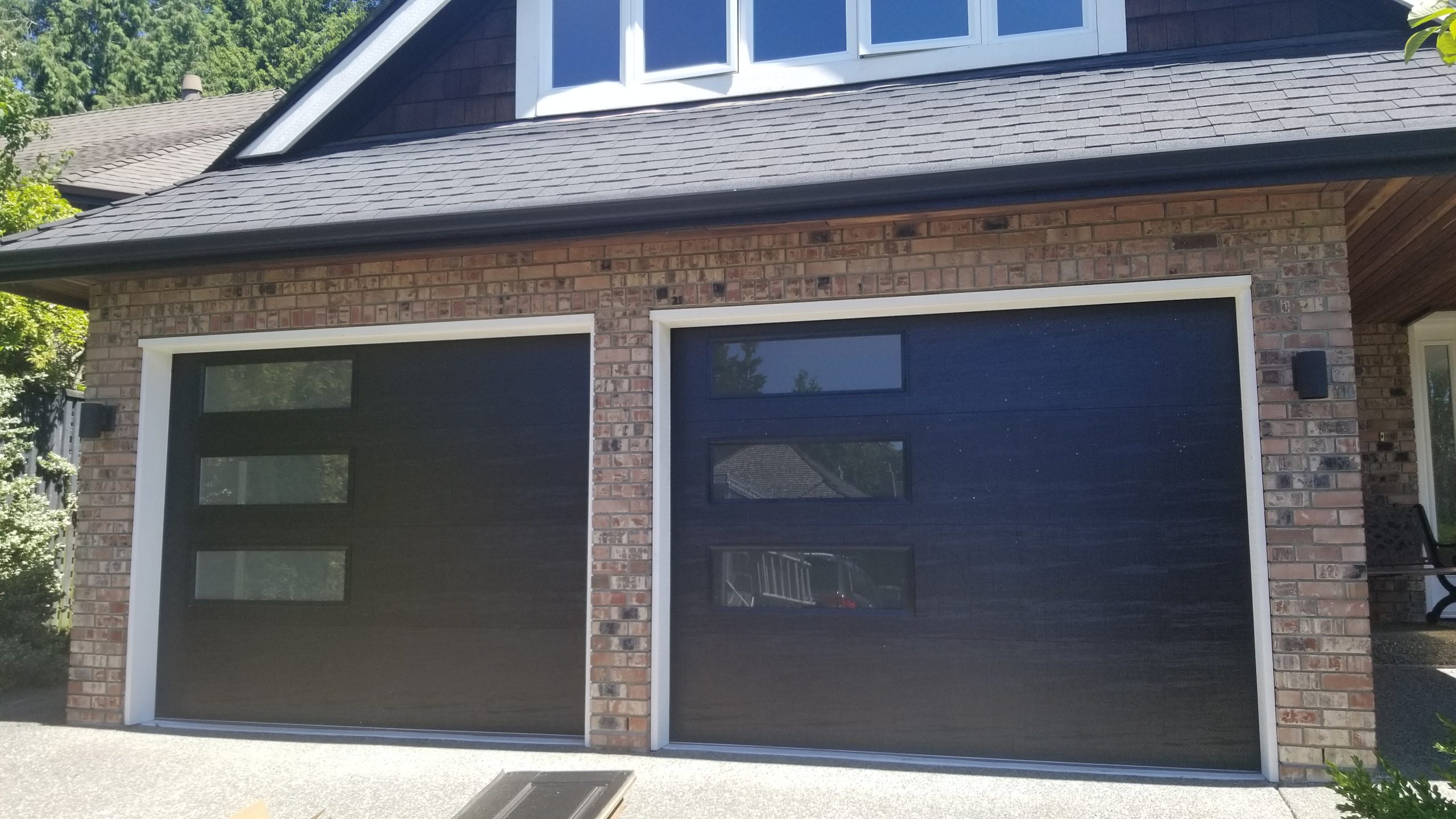 2 side by side single garage door with windows