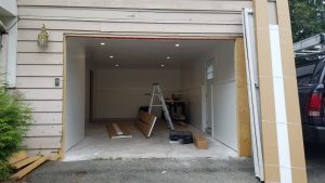 old house garage door being replaced