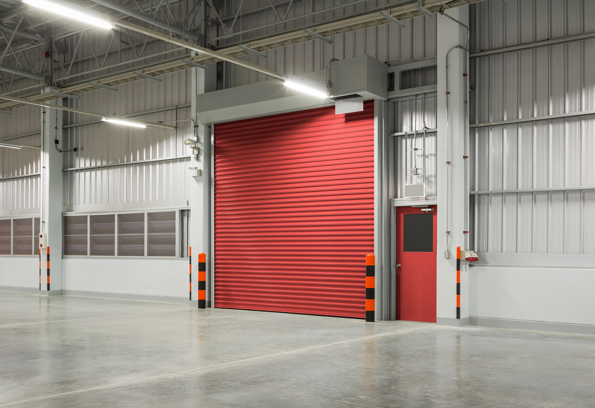 red commercial garage door for industrial warehouse loading bay